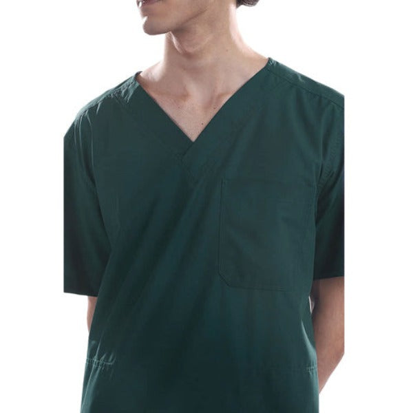 A doctor in green scrubs standing in a brightly lit operating room, looking at a monitor. This visually connects the color to the environment